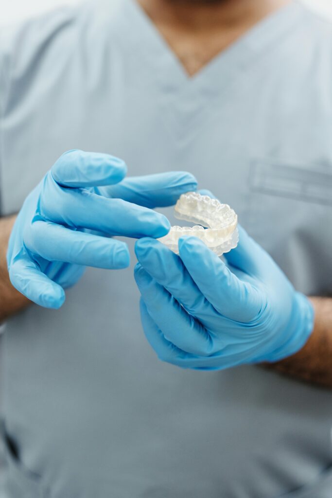 pexels-photo-4270079-4270079 Person in Gray Scrub Suit Wearing Blue Latex Gloves